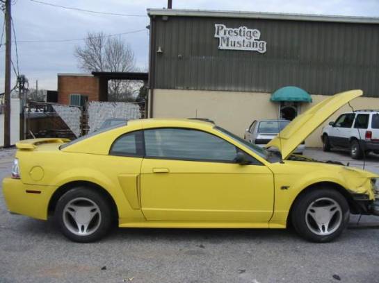 2002 Ford Mustang 4.6 2V 5-Speed T-3650 - Yellow - Image 1